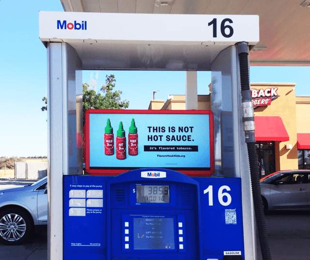 Gas pump ads for hot sauce.