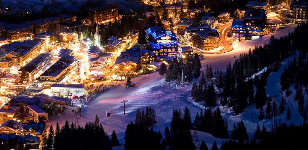 A French Resort lit brightly at night