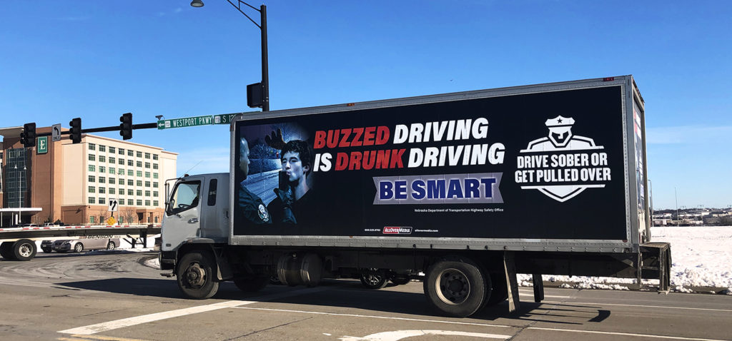 A Drive Sober or Get Pulled Over ad on the side of a truck