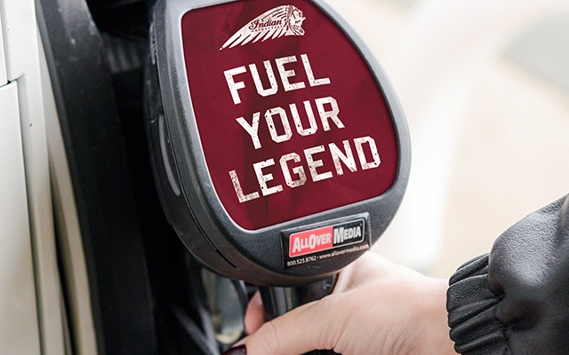 Gas nozzle ad for Indian Motorcycles being pulled out of the pump