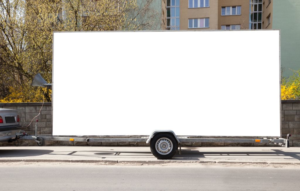 Blank billboard on car trailer