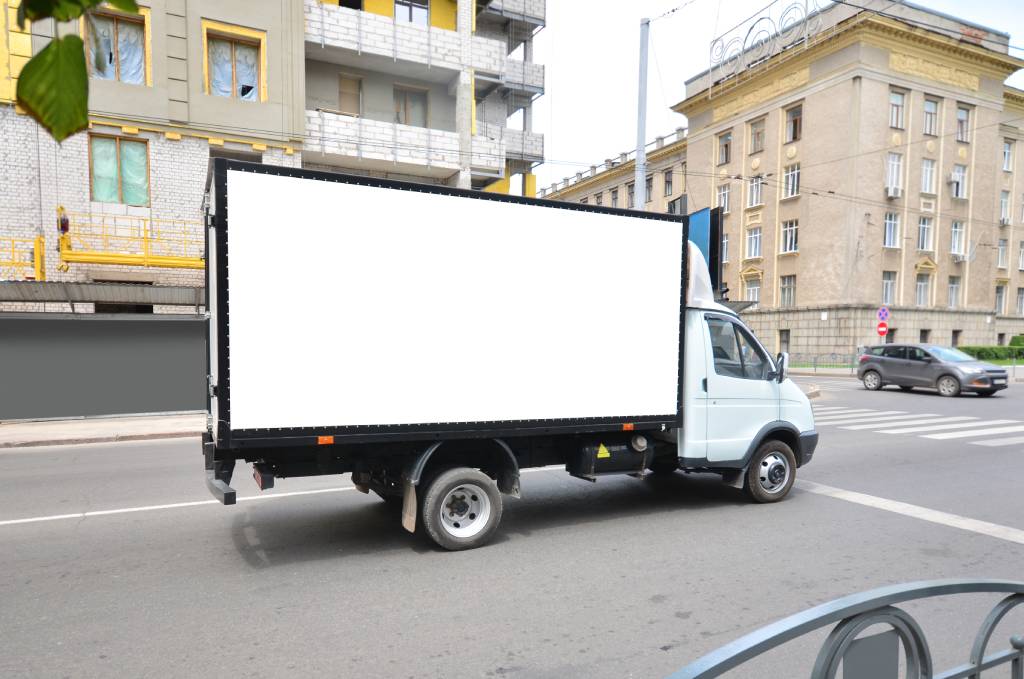 Commercial truck with empty mockup banner on a van