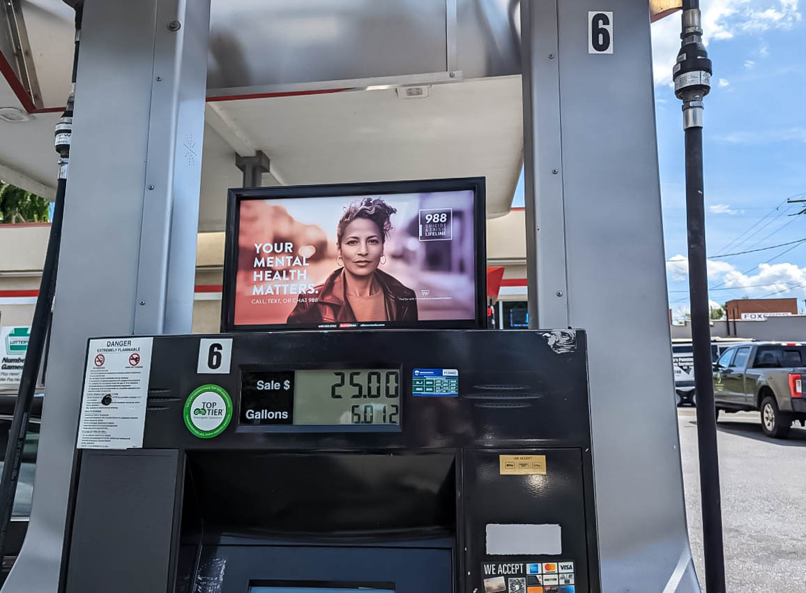 Advertisement displayed above the meter on a gas pump