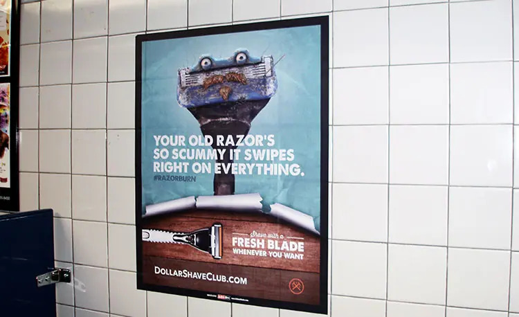 Bathroom advertisement for Dollar Shave Club