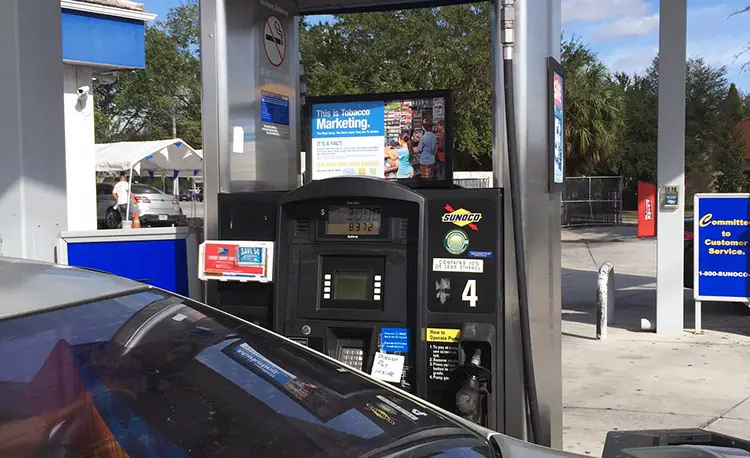 Gas pump with advertisements and coupons in it