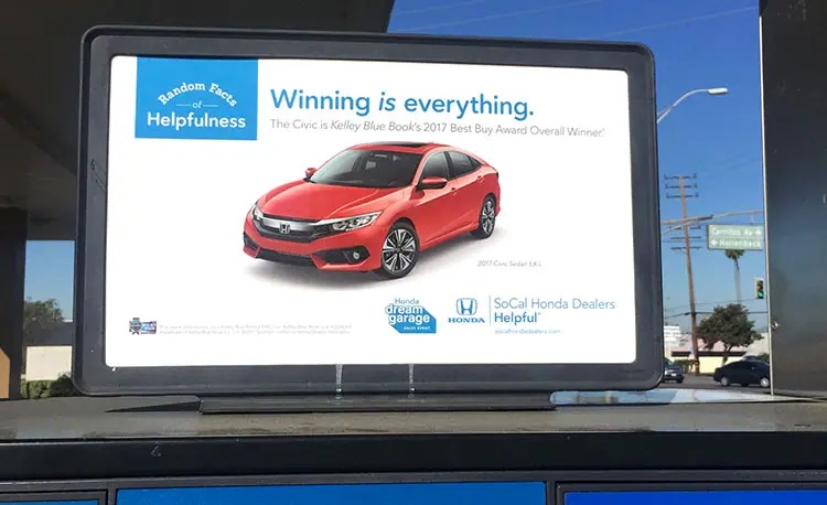 Honda Random Facts of Helpfulness advertisement on a gas pump