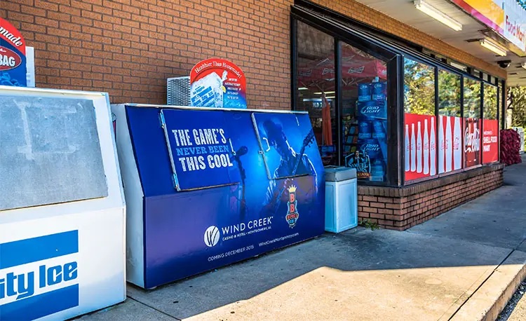 Wind Creek Casino advertisement on the ice box of a gas station