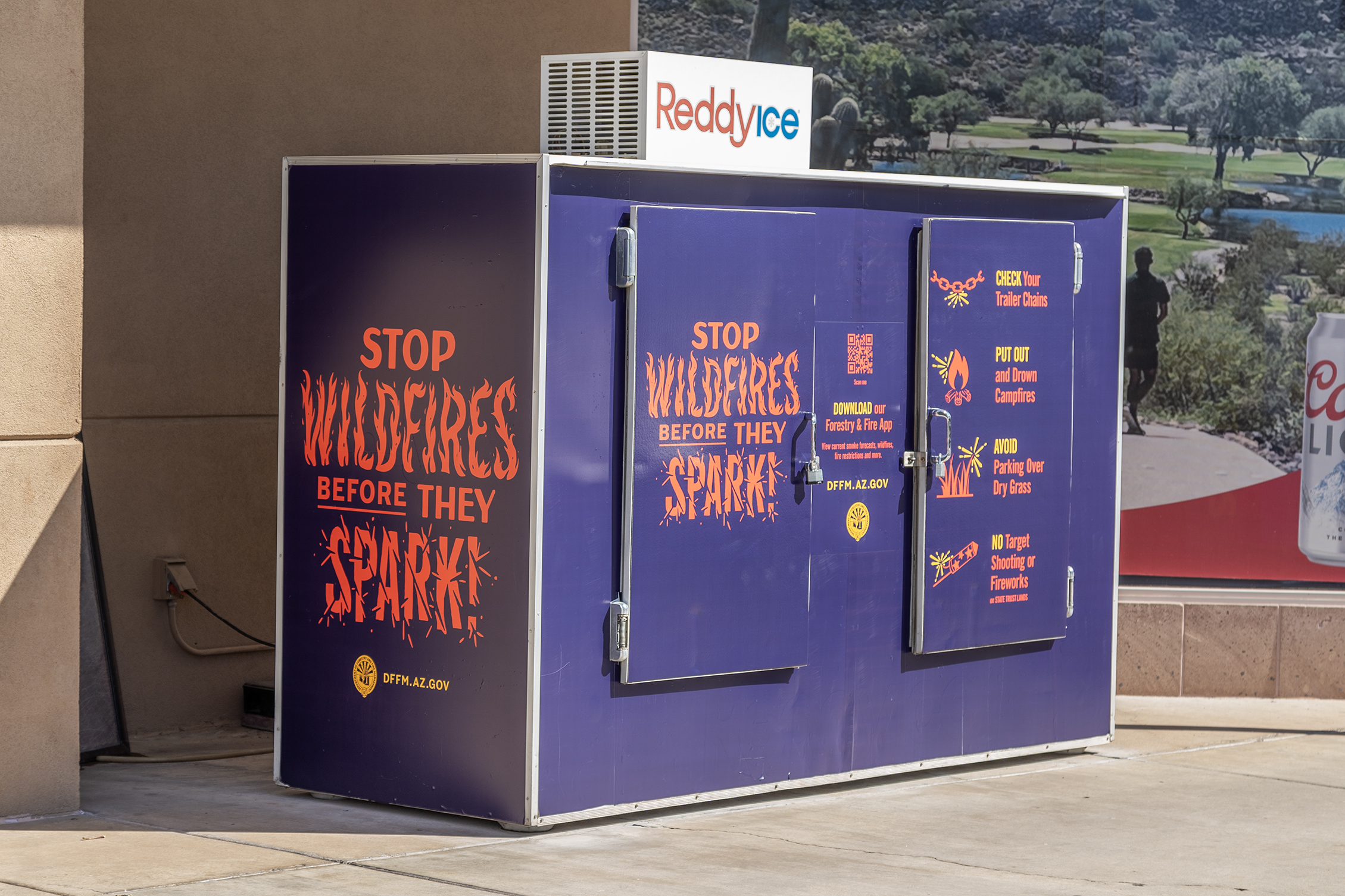 PSA advertisement to stop wildfires on the outdoor ice box of a convenience store in Arizona