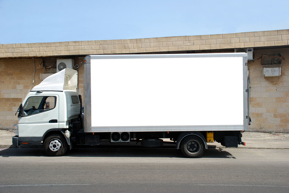 A short truck with a white banner 