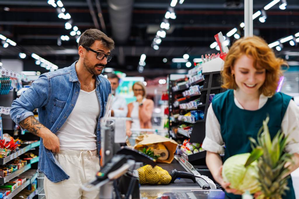 A person checking out at a grocery store